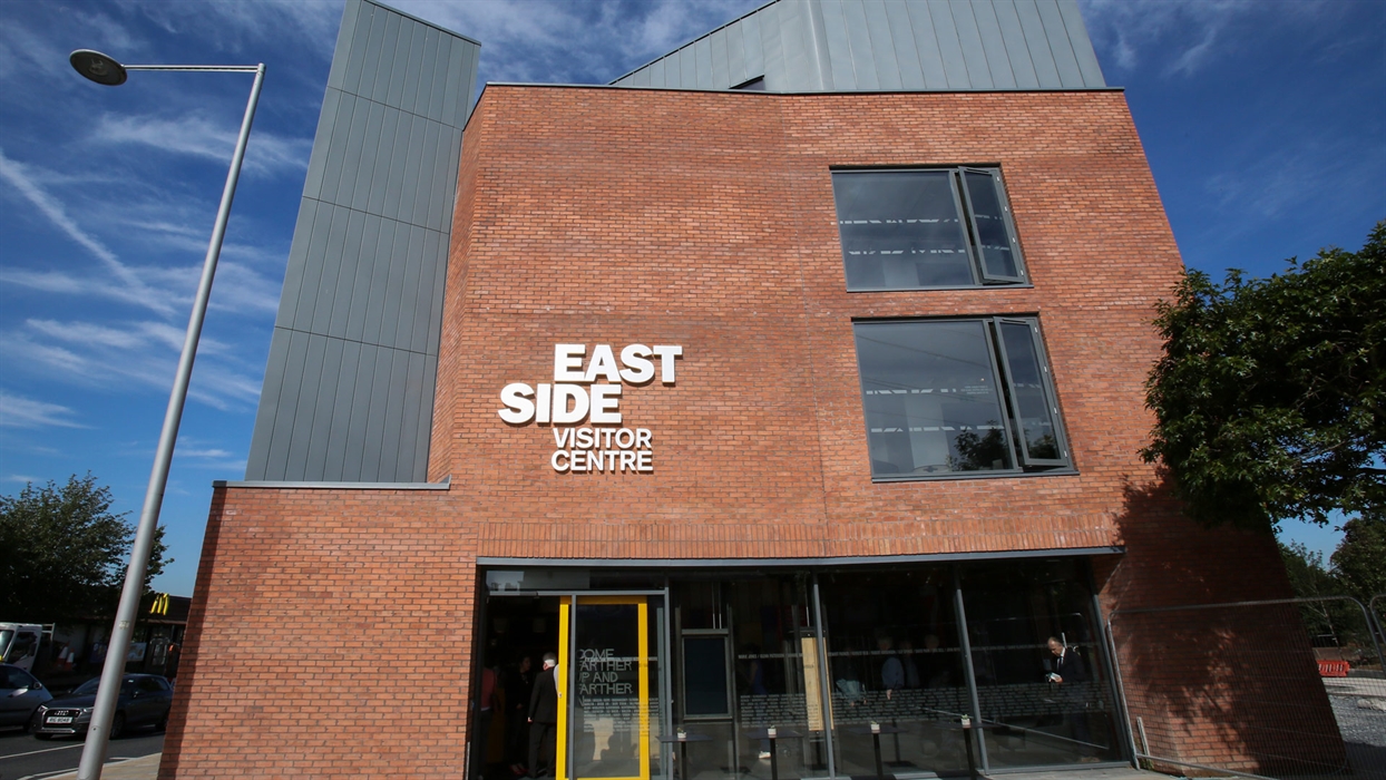 The red-brick EastSide Visitor Centre beside C. S. Lewis Square, Belfast.